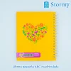libreta_pequeña_marca_ABC_color_amarillo_con_corazon_y_flores_atras